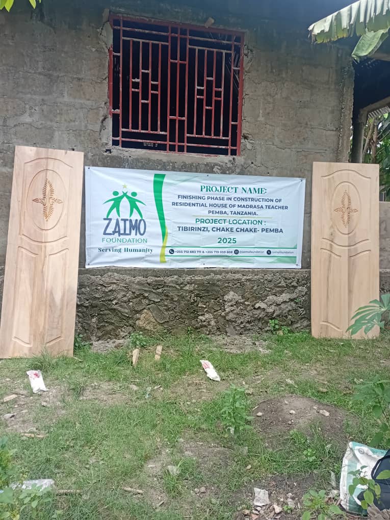 Banner and two wooden doors for the Finishing Phase in Construction of Residential House of Madrasa Teacher in Tibirinzi, Chake Chake, Pemba