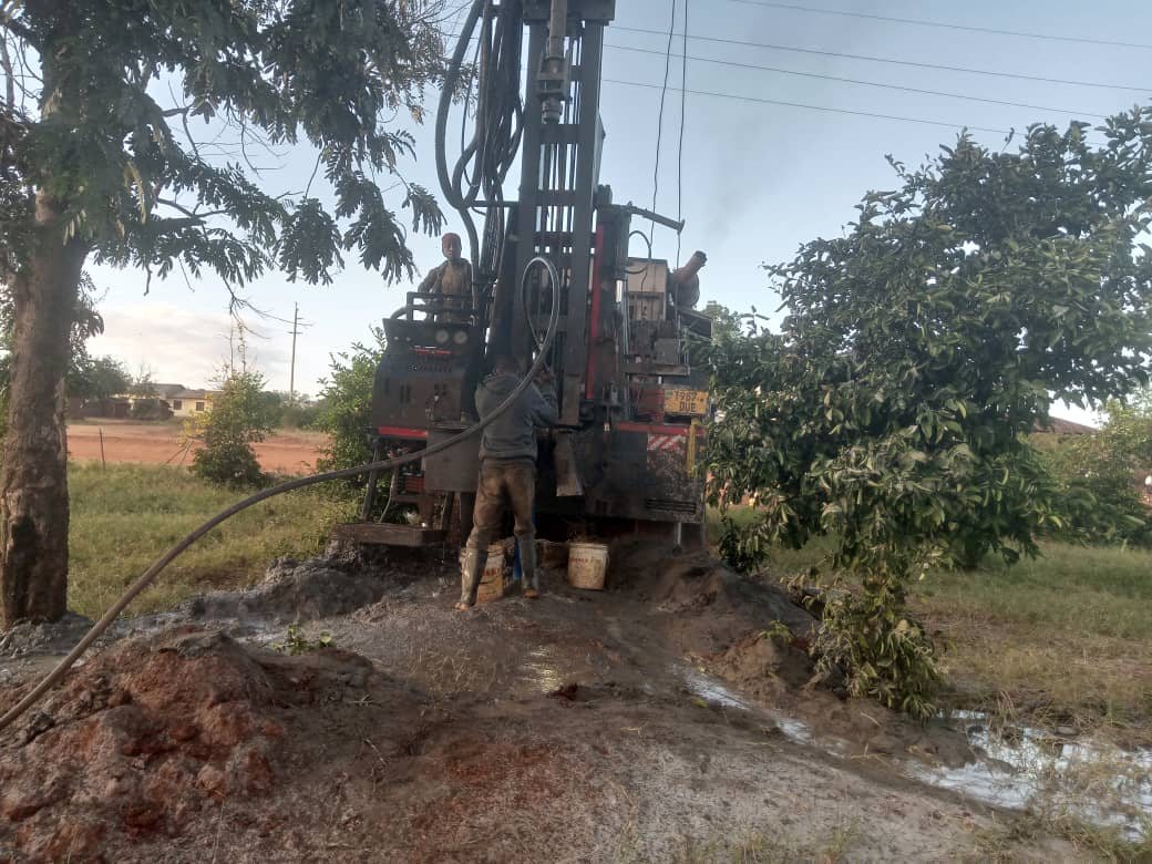 A drilling rig at the Mwakijembe water well site