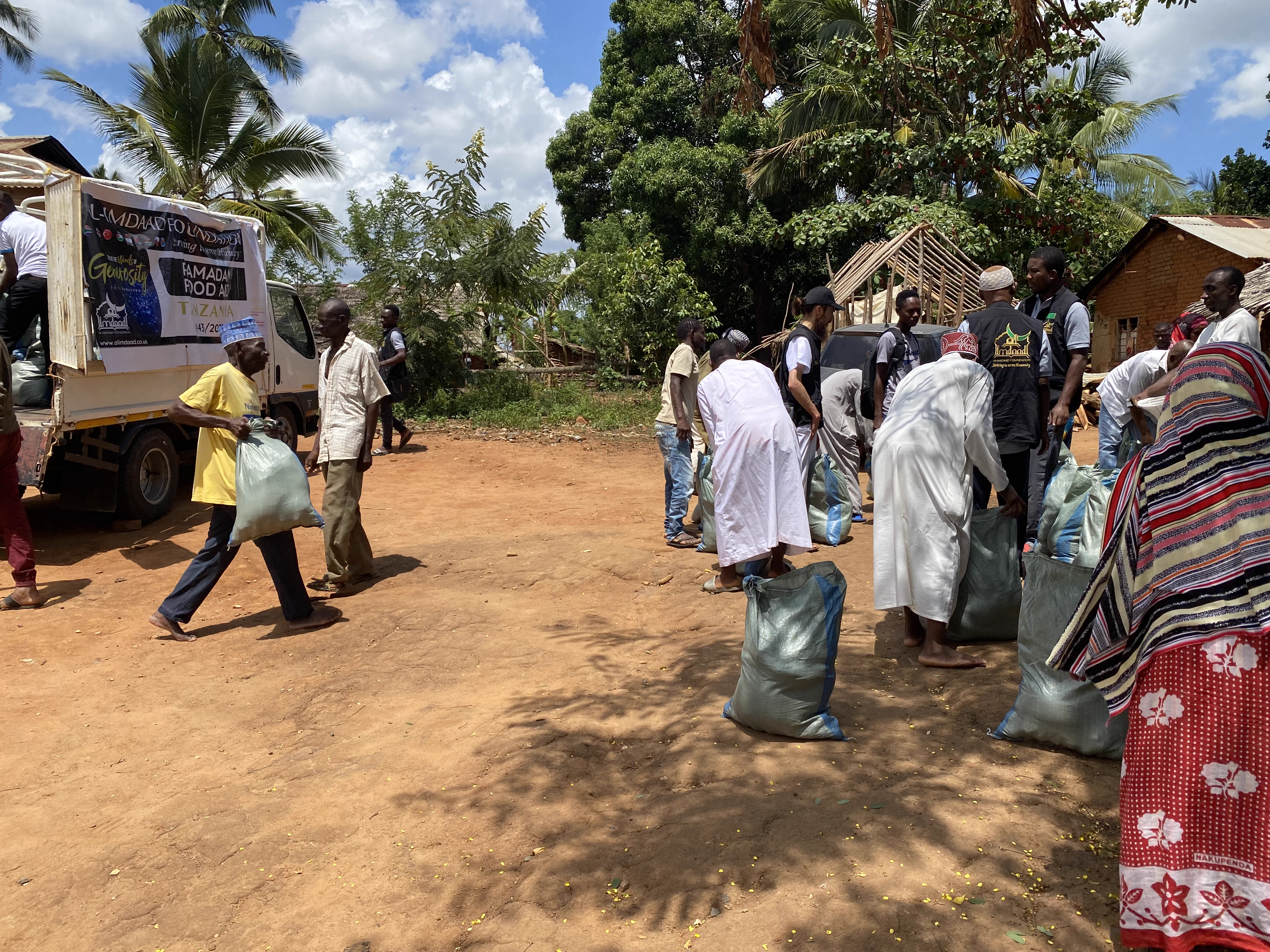 Large crowd of community members and volunteers at Ramadan food distribution