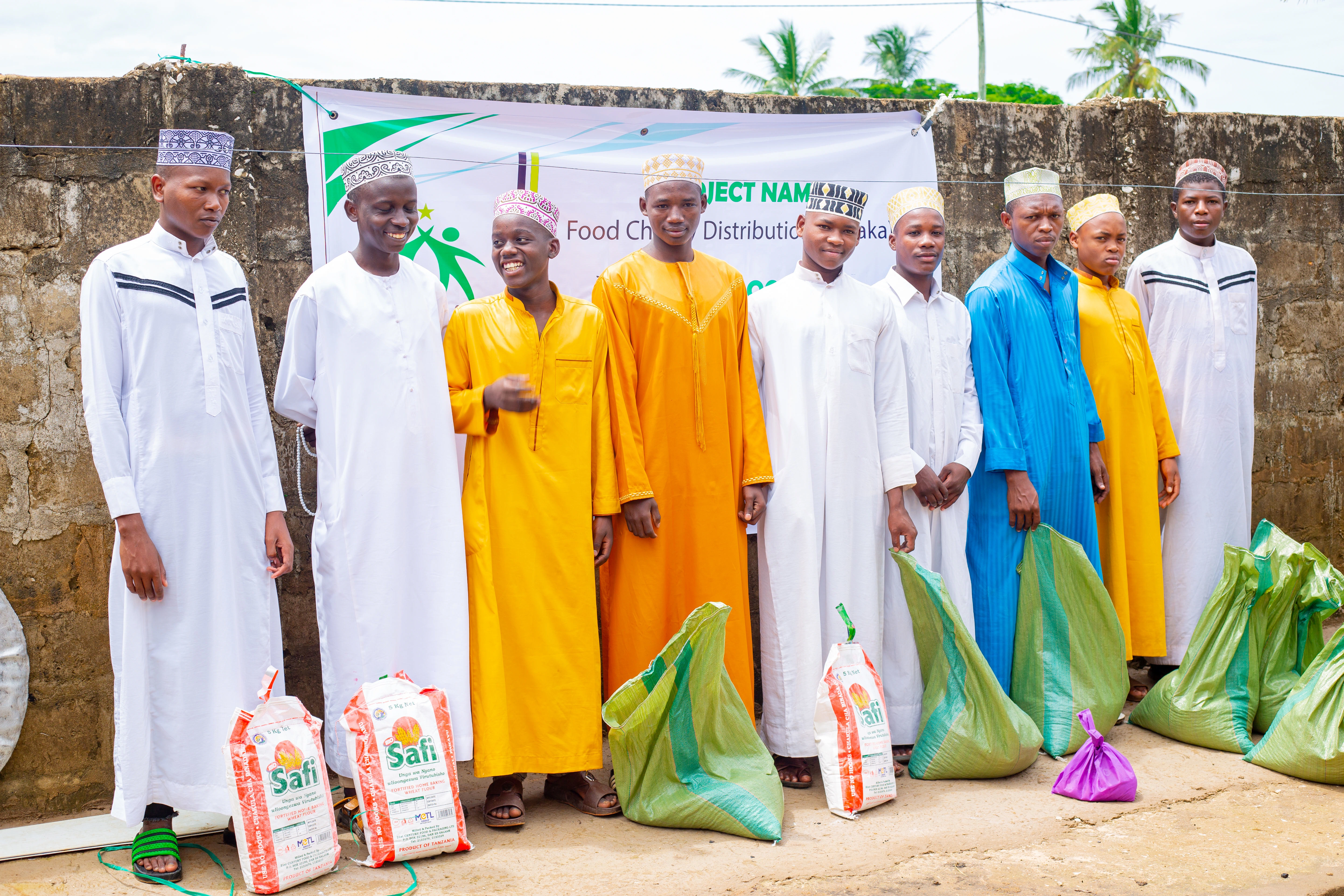 Group of rural children and students gathered with Sadaqah food hampers